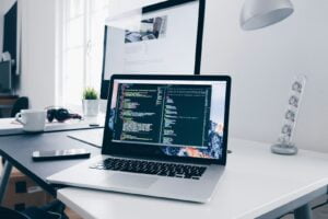 wiss Web Agency Website Design Services Laptop on a table displaying a modern, professionally designed business website