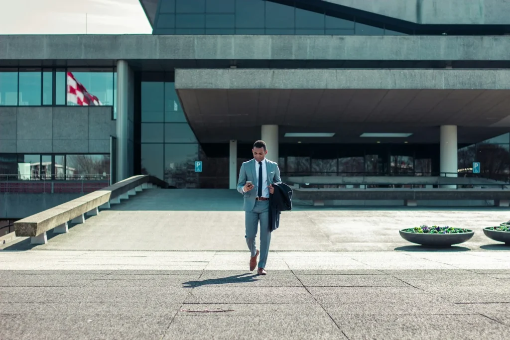 Foreign entrepreneur walking outside a Swiss government building after registering a business in Switzerland